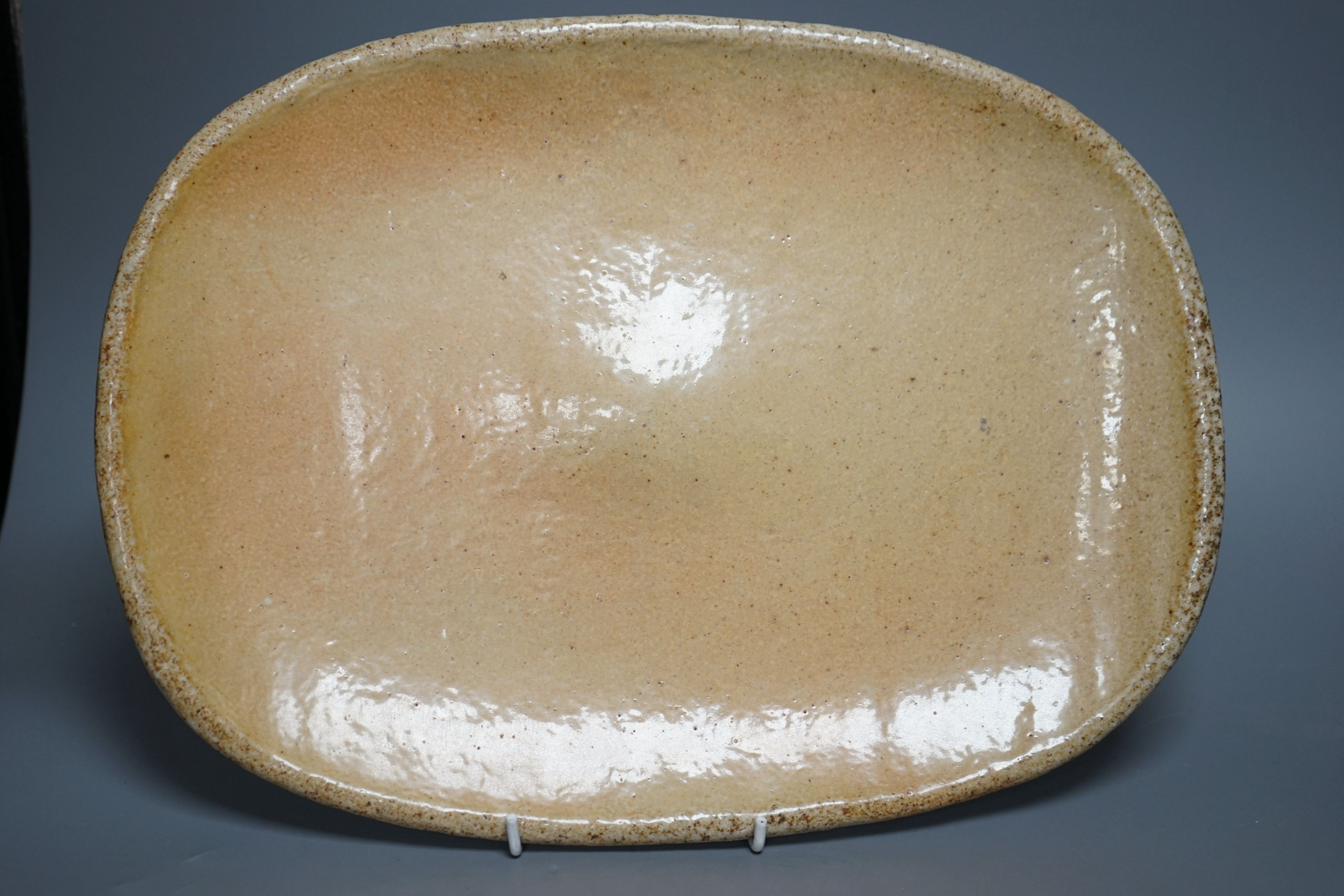 British studio pottery; a group to include a Micki Schloessingk (b.1949) salt glaze teapot and cover, together with other similar items and other studio pottery wares, largest 39cm wide, (5)